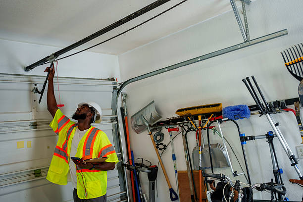Professional Garage Door Panel Replacement technician working in Clay, KY